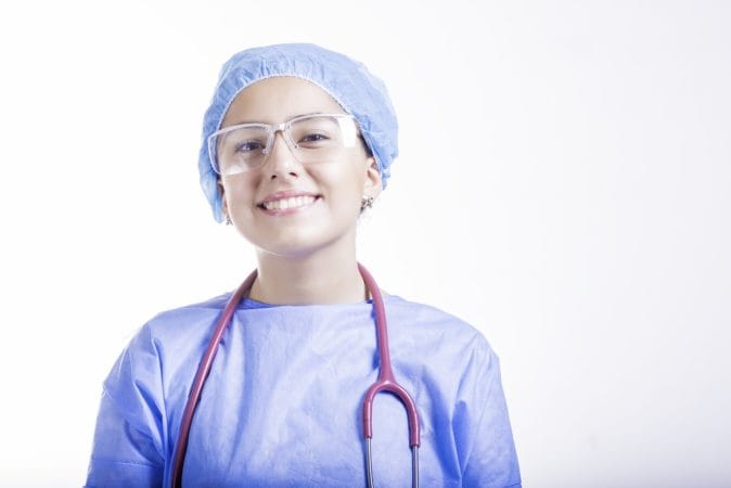 A female Chinese doctor smiling.