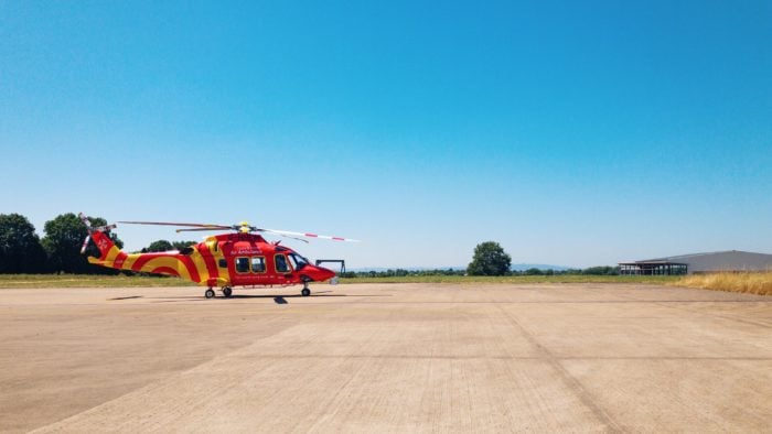 An air ambulance helicopter on a helipad.