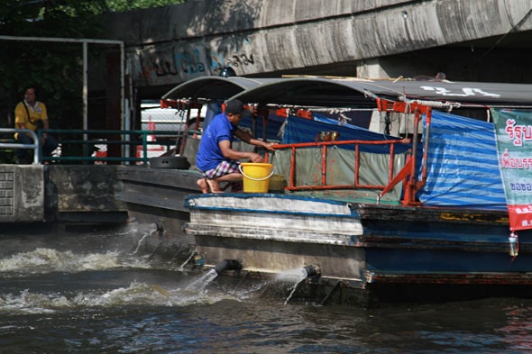 Thai Floods: Six Boats Pushing Flood Water