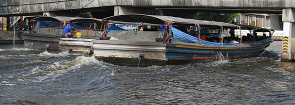 Thai Floods: Six Boats Pushing Flood Water