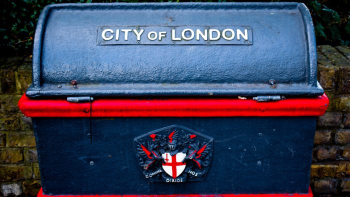 A blue and red UK Post box.