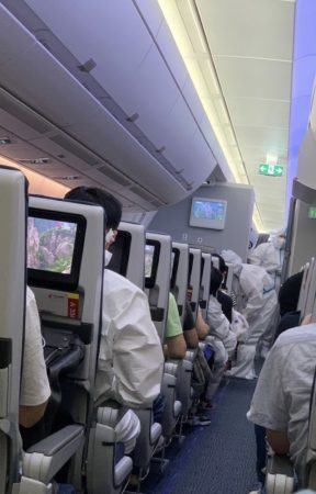 cabin crew wearing PPE.