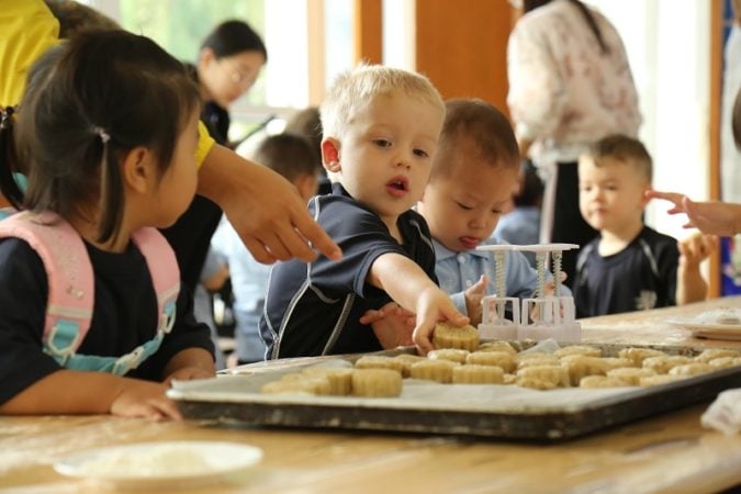 students making mookcakes at Harrow International School Beijing