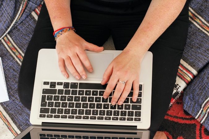 IT worker working on a laptop. 