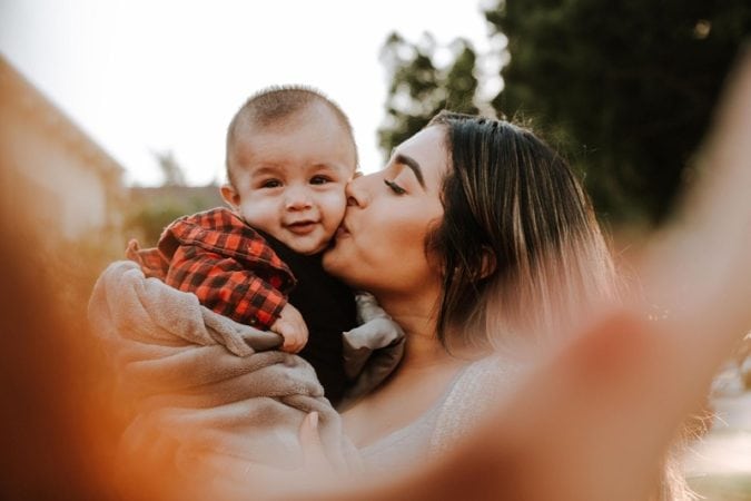 A happy baby and its mother