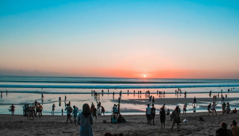 watching beautiful sunset at Kuta beach, Bali. 