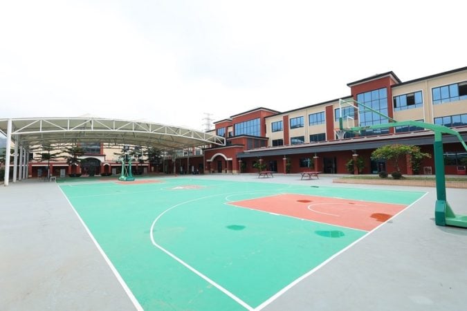 The basketball courts and playground at Affiliated School of JNU Guangzhou.