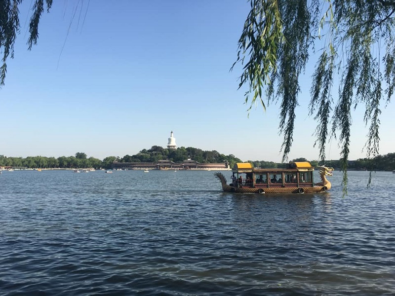 Dragon boat ride on the lake in Beihai park. 