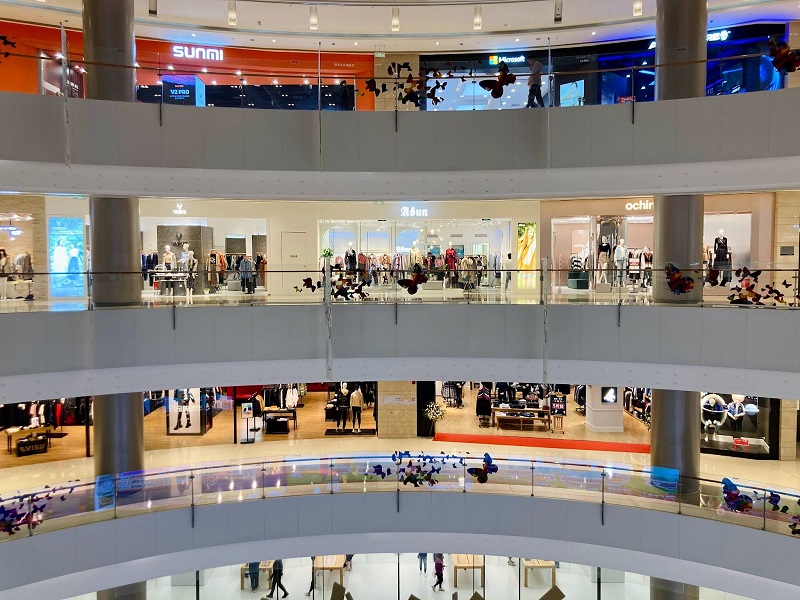 A photo of 3 layers of the inside of a shopping mall.  