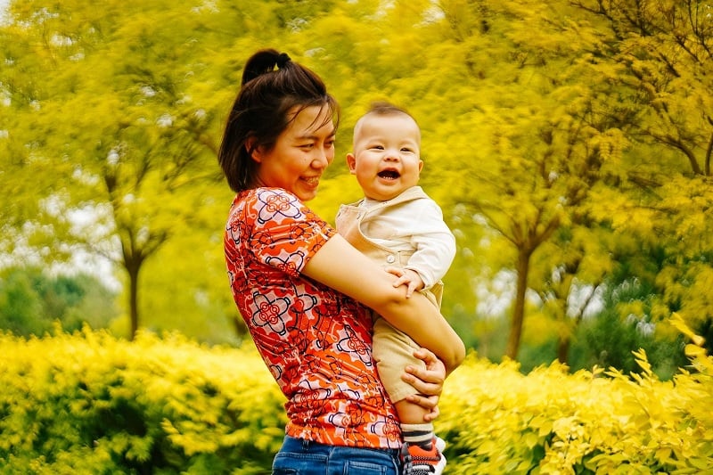 Photo of a Chinese nanny holding a baby 