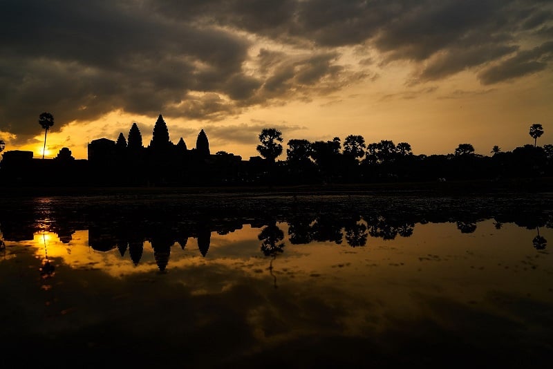 Photo of sunset over ancient temples in Siem Reap, Cambodia. 