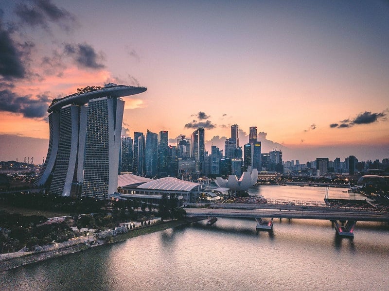 A view of the Singapore skyline at sunset. 