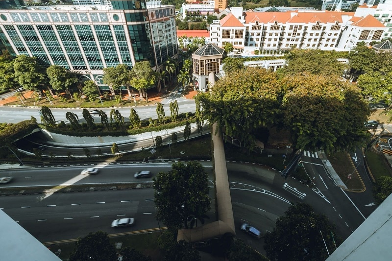 A Singapore road photo looking down at the highway from a tall building. 