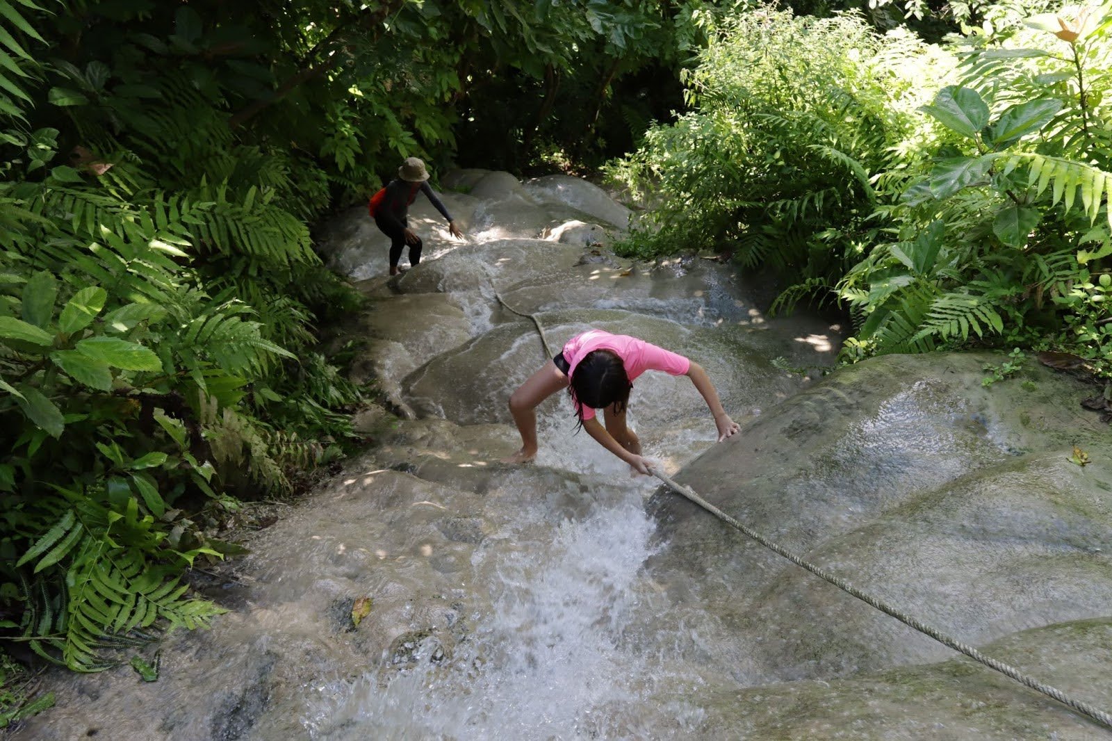 kids climbing the sticky waterfalls in Chiang Mai