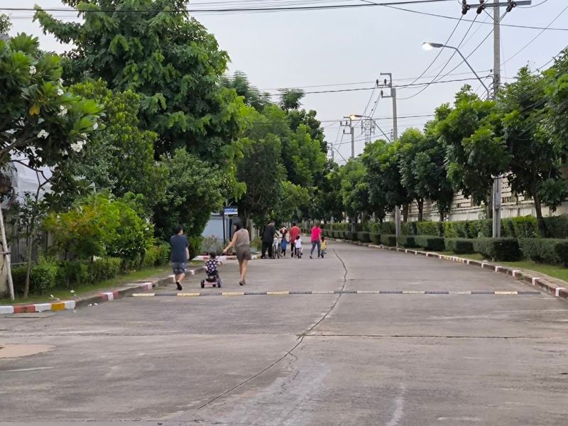 kids playning in a gated community in bangkok suburbs