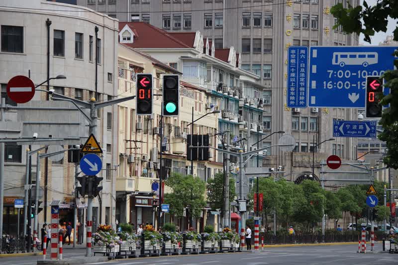 A city street in Shanghai with traffic and buildings