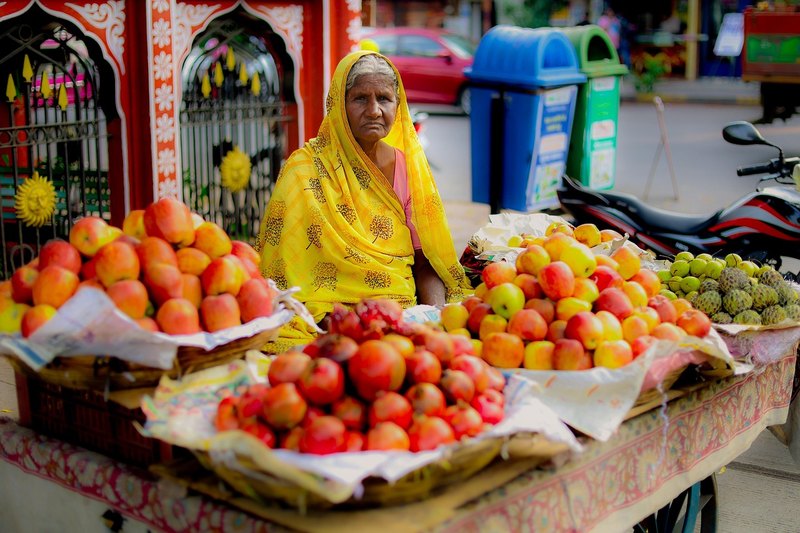 A fruit seller at a public market in the Philippines