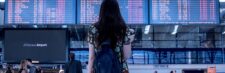 Traveler checking a phone at the airport