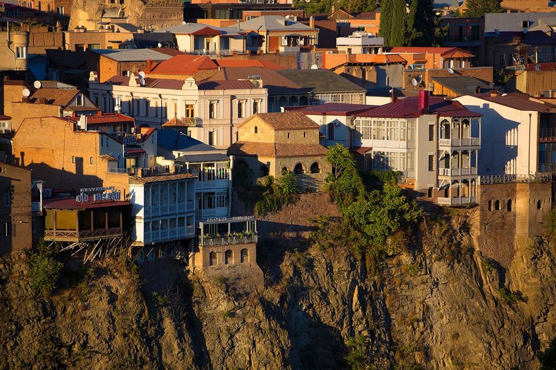 Old town houses on the cliff above the Mtkvari river in Tbilisi, Georgia