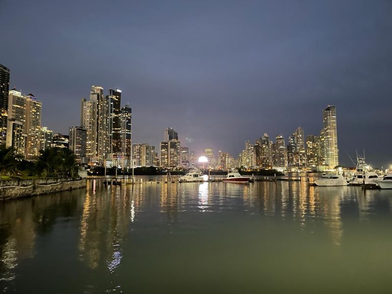 Panama City skyline at night seen across the Paitilla marina