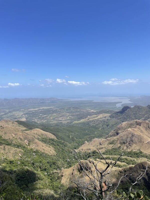 View from the Panama highlands across a green valley toward the Pacific coast