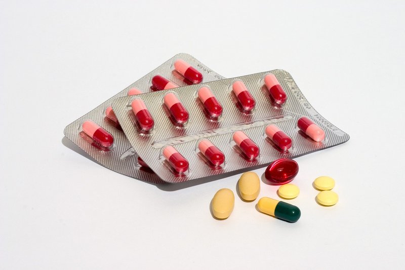 Red and white capsules in a blister pack