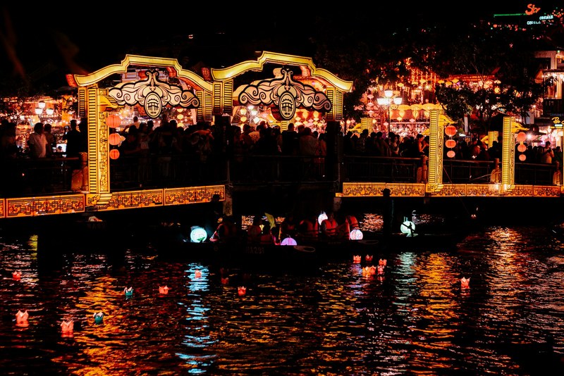 Lantern-lit bridge and river in Hoi An at night
