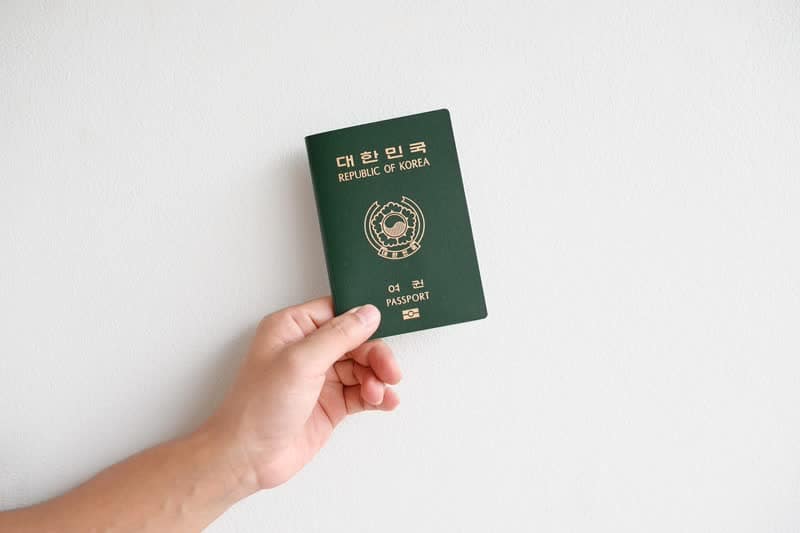 Traveler holding a passport before entering Vietnam