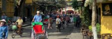Lanterns and a cyclo on a street in Hoi An's old town, Vietnam